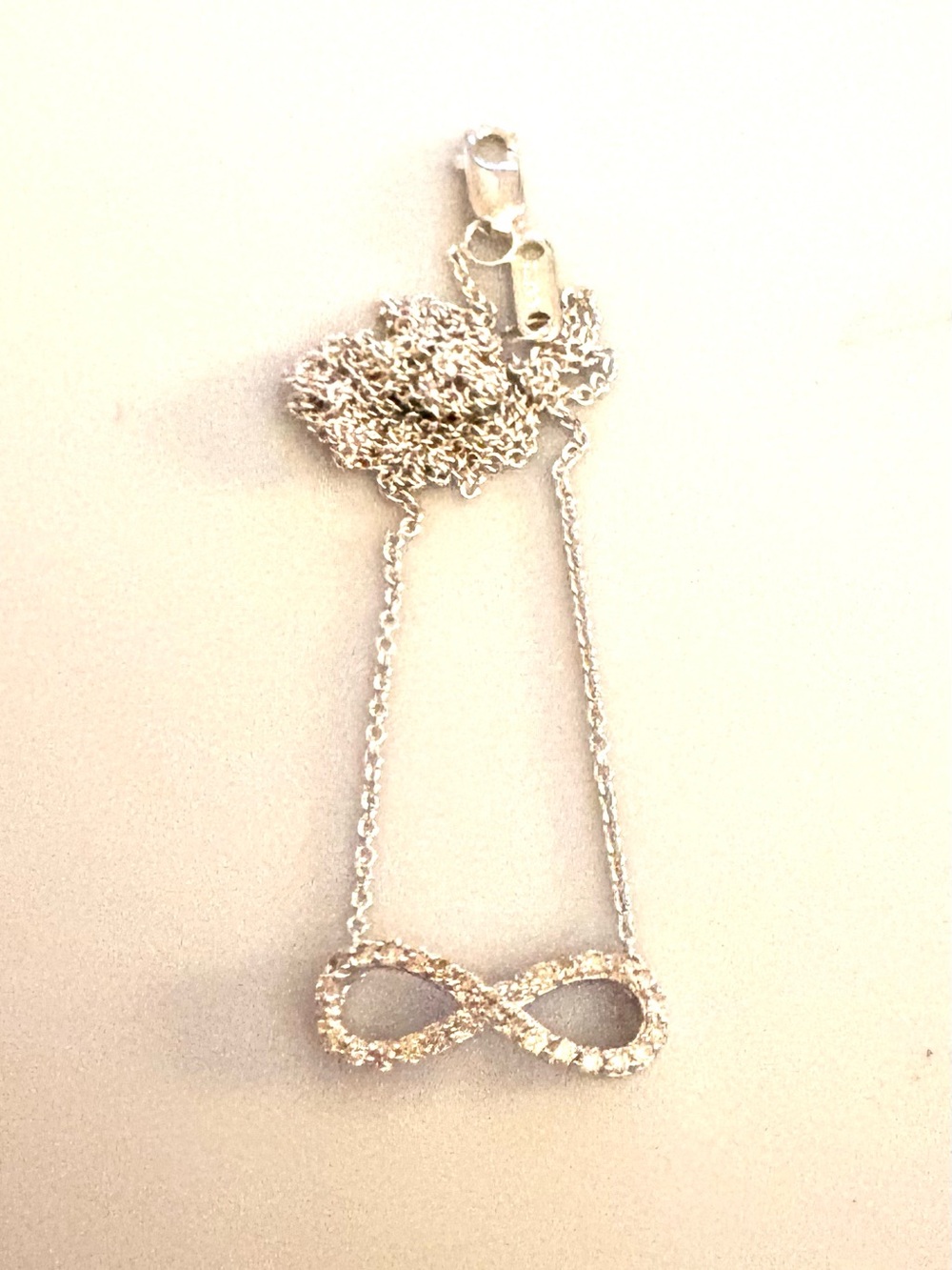 Vintage Zales 1/10 CT. T.W. Diamond Sterling Sideways Infinity Necklace